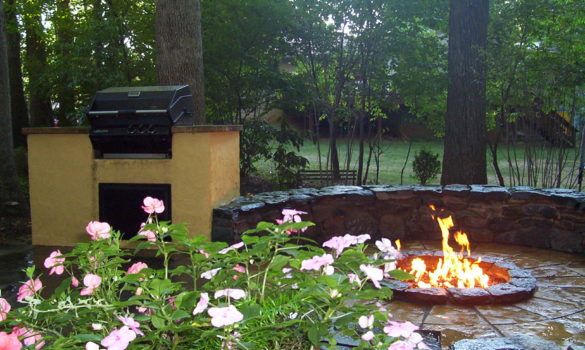 freshly built stone fire pit in a backyard