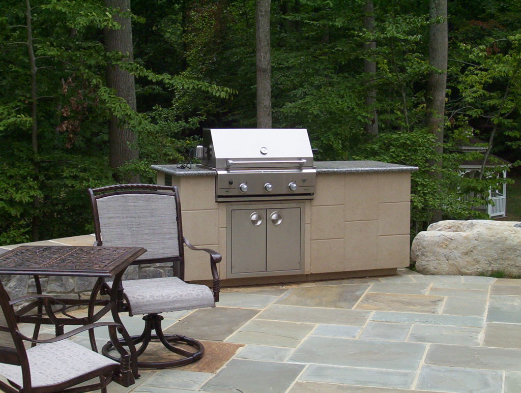 Stone Patio, Outdoor Kitchen and Water Feature in Bethesda, MD