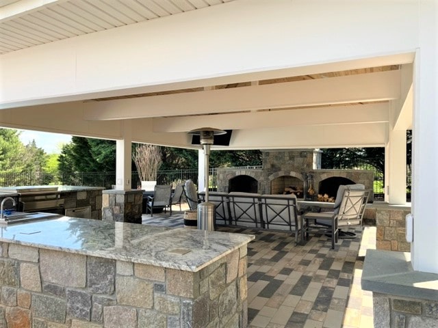 Outdoor kitchen installation with full fireplace