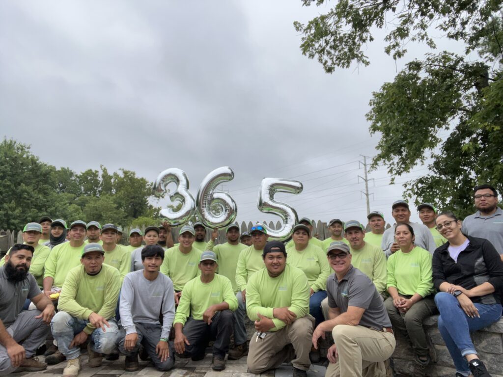 landscape design and installation staff of Allentuck Landscaping celebrating one year injury free work place in Maryland