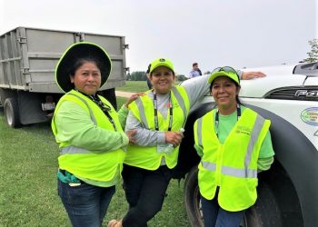 Allentuck landscaping employees posing for a group photo at the national mall project next to their truck