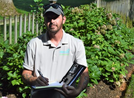 Mark Meyer holding his notebook at a job site