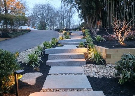 landscaped design with new steps, mulch, and plants
